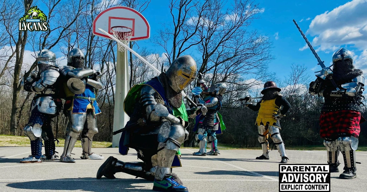 An image of the Lexington Lycans Armored Combat Team standing in team colors and full armor on a set of stairs.