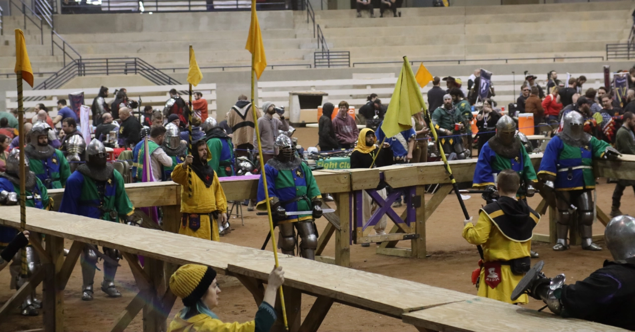 An image of the Lexington Lycans Armored Combat Team standing in team colors and full armor on a set of stairs.